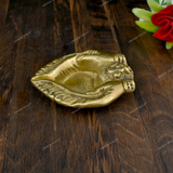 Brass Diya Placed in Welcoming Hand