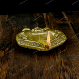 Brass Diya Placed in Welcoming Hand