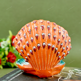 Enamelled Metal Ganesha Idol Seated in A Sea Shell - Orange