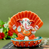 Enamelled Metal Ganesha Idol Seated in A Sea Shell - Orange