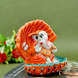 Enamelled Metal Ganesha Idol Seated in A Sea Shell - Orange