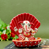 Enamelled Metal Ganesha Idol Seated in A Sea Shell - Red