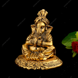 WHITE METAL GOLDEN GANESHA WITH MANJIRA