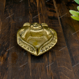 Brass Diya Placed in Welcoming Hand